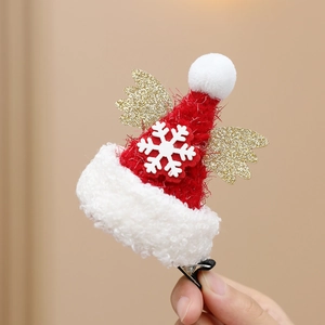 Christmas reindeer antler hair clip with red hat and golden wings for festive parties