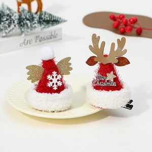 Detail of Christmas reindeer antler hair clips with gold sequins and velvet trimming
