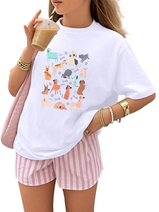 Detailed close-up of cartoon dog print on white t-shirt and pink striped shorts set