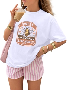 Close-up of retro bee graphic and Sweet Like Honey print on a white cotton t-shirt