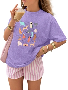 Detail view of purple crew neck t-shirt featuring colorful cartoon dog breed prints