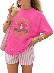 Detail of honey bee print on pink cotton T-shirt with Sweet Like Honey lettering