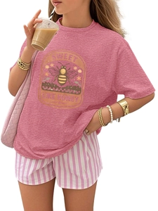 Detail of a vintage honey bee print on a dusty pink crew neck T-shirt with shorts