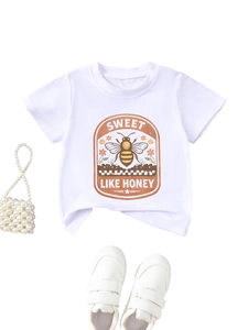 Detail of vintage honey bee print on white cotton t-shirt with orange floral border