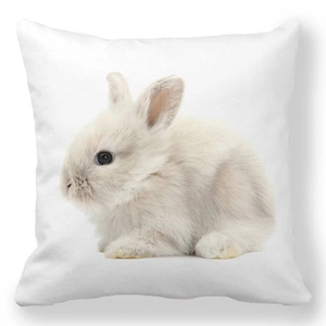 Detailed close-up of fluffy white rabbit print on soft peach skin fabric pillowcase