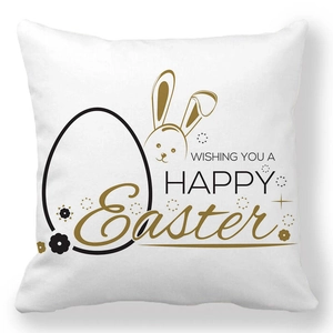 Detail des Osterkissenbezugs mit goldenem Hasen und Happy Easter Grußtext