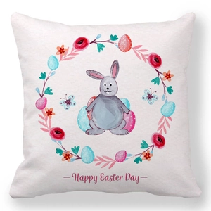 Detail eines Oster-Kissenbezugs mit Cartoon-Hase und buntem Blumenkranz auf Pfirsichhaut