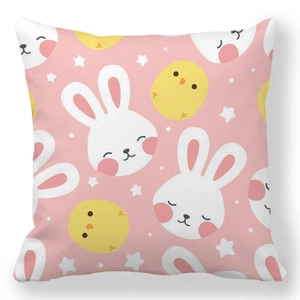 Detailed close-up of pink Easter pillowcase featuring cute rabbits, chicks, and stars patterns