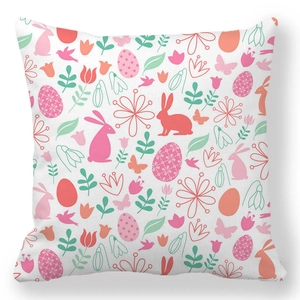 Detail showing Easter bunny and colorful egg patterns on soft peach skin pillow cover
