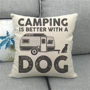 Close-up of linen cushion cover with Camping Is Better With A Dog print and retro RV design