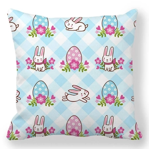 Detail of Easter bunny and egg patterns on light blue checkered peach skin pillowcase