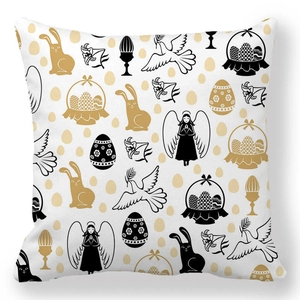 Detail of Easter pillowcase with black and gold bunny and egg pattern on white fabric