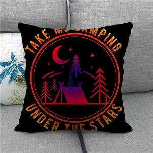 Detail of Happy Camper linen cushion cover featuring a colorful tent and stars on a sofa
