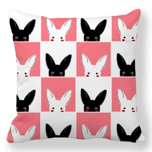 Detail of soft peach skin cushion cover with black and white peeking bunny pattern