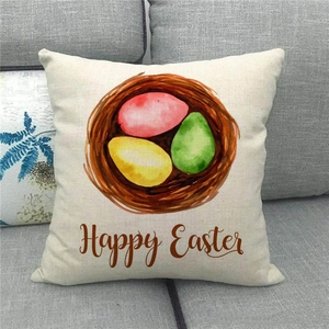 Linen Happy Easter pillowcase with bird nest and colorful eggs on a sofa