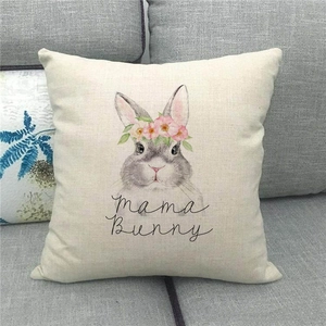 Detailed texture of linen pillowcase with watercolor mama Bunny design on gray sofa