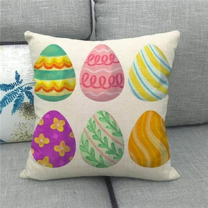 Detail of Easter pillowcase showing six colorful egg patterns on linen fabric texture