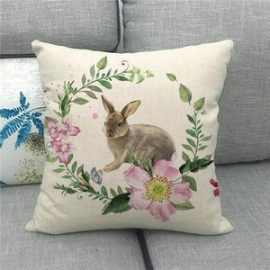 Close-up of Easter linen pillowcase with watercolor rabbit and floral wreath pattern