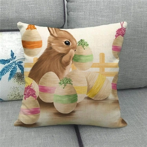 Linen Easter throw pillow case featuring realistic rabbit and colorful eggs on a sofa