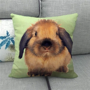 Detailed texture of Easter linen pillowcase with cute rabbit print on grey sofa