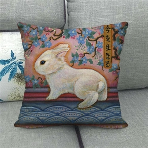 Linen pillowcase with white rabbit and blue flowers pattern for Easter home decor