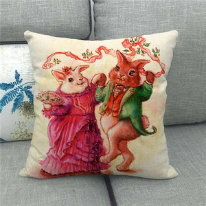 Detail of linen pillowcase featuring Victorian rabbits on a grey fabric sofa