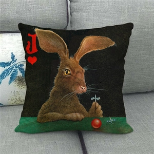 Detail of linen pillowcase featuring artistic rabbit and Ace of Hearts playing card design