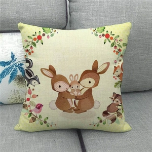 Linen Easter pillow cover with forest animal illustrations and cute bunnies on a sofa