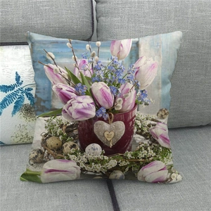 Detailed texture of linen Easter pillow cover with tulip and nest pattern on gray sofa