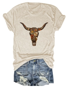 Detail of floral cow skull print on beige T-shirt with distressed denim shorts