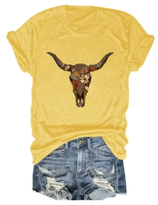 Flat lay of women's yellow T-shirt with floral bull skull print and denim shorts