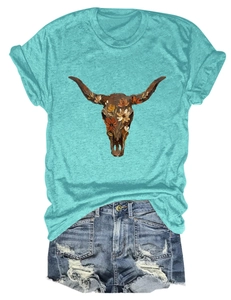Detail of vintage bull skull and flower print on turquoise T-shirt with frayed denim shorts