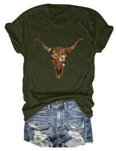 Flat lay of olive t-shirt with floral bull skull print and ripped denim shorts