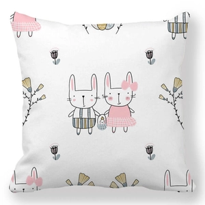 Detailed view of square peach skin pillowcase featuring hand-drawn Easter bunnies and flowers