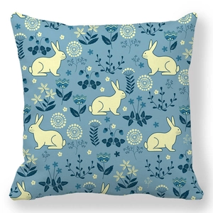 Detail of navy blue pillowcase with yellow rabbit pattern and floral botanical illustrations