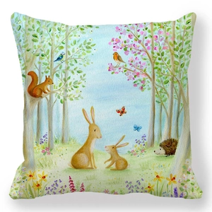 Detail of soft peach skin cushion cover featuring watercolor rabbit and forest animals