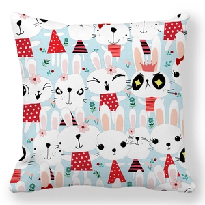 Detail view of the cute cartoon rabbit patterns on light blue soft peach skin pillowcase