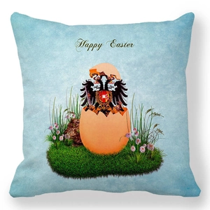 Detail van Happy Easter kussensloop van perzikzachte stof met adelaar en bloemen