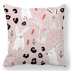 Detail of soft peach skin fabric texture with rabbit and carrot print on Easter pillowcase