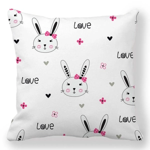 Close-up of Easter rabbit and heart print on white peach skin fabric cushion cover
