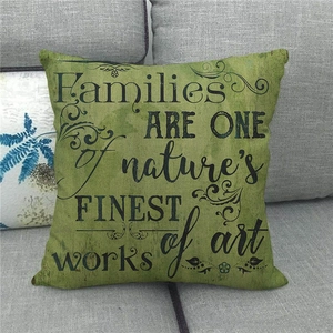 Close-up of vintage green linen cushion cover with nature's finest art quote