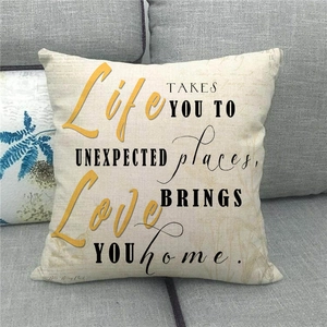 Macro detail of natural linen pillow cover featuring elegant motivational typography