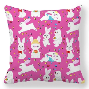 Close-up detail of cartoon rabbits and colorful beans on peach skin pillowcase fabric