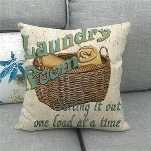 Close-up of a linen pillowcase featuring a vintage Laundry Room illustration and typography