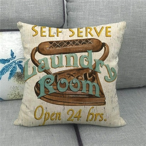 Close-up of vintage laundry room iron print on linen pillowcase with retro text