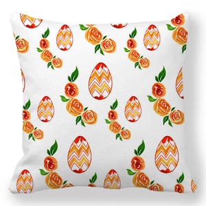 Close-up of peach skin throw pillow with watercolor Easter eggs and floral patterns