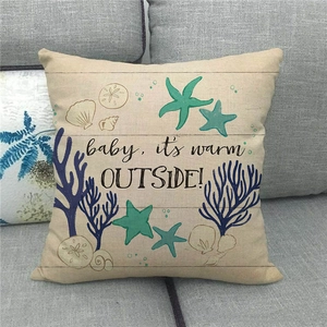 Detail showing linen pillow cover with starfish and coral prints and ocean text