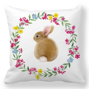 Detail of bunny and floral wreath print on peach skin square decorative pillowcase