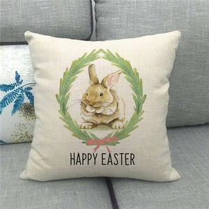 Dettaglio fodera cuscino pasquale in lino con coniglio, ghirlanda e scritta Happy Easter