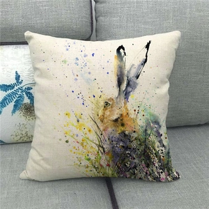 Detailed texture of linen cushion cover featuring watercolor Easter bunny and yellow florals